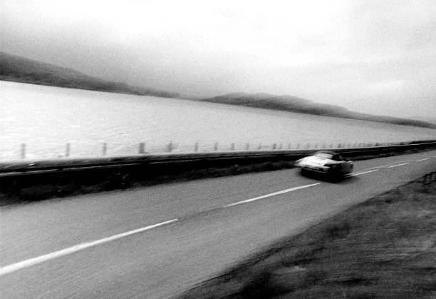 istock Sports car speeding down road 179288571