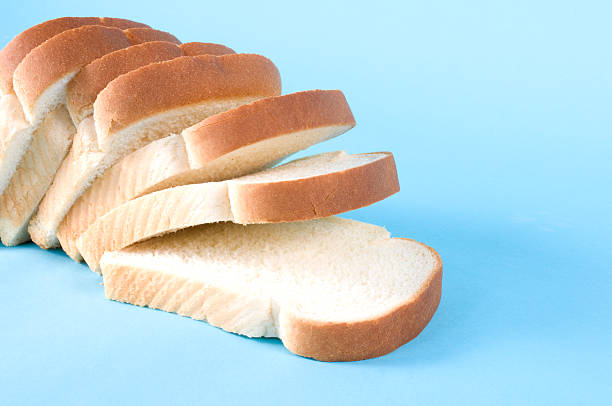 istock Loaf of sliced white bread on blue background 179288743