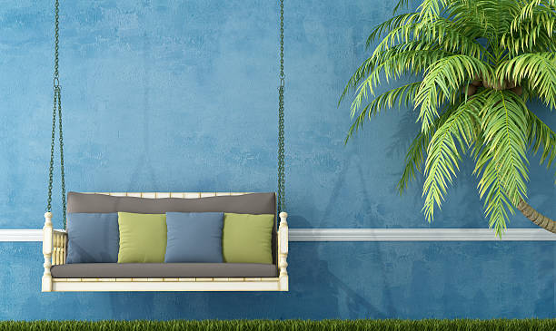 istock Vintage wooden swing against blue wall 179289079