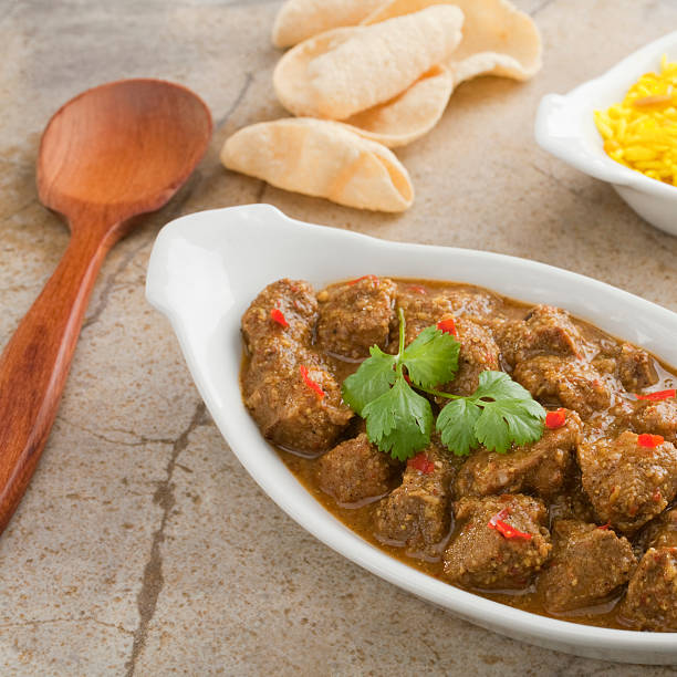 istock Indian Curry Pork Vindaloo and Poppadums 179289100