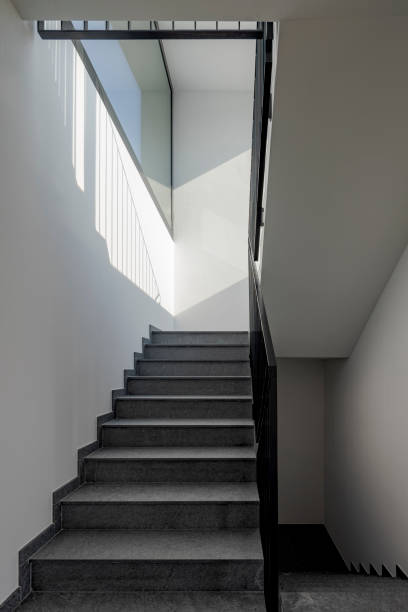 istock Front view of a modern stone staircase inside a newly built apartment building 1792891874