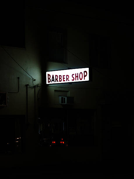 istock Lit Up Barber Shopt Sign at Night 179289452