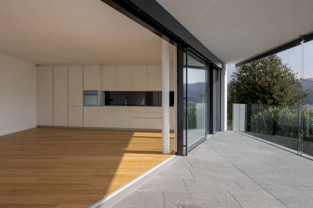 istock Inside a large space, a studio with a kitchen and a large window opening onto the terrace. 1792896779