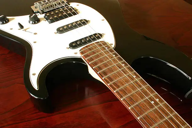electric guitar on a pine wood table