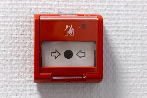 Pull station or call point, Manual fire alarm activation, Activated Notifier pull station, Modern fire alarm pull stations, Single action to pull down the handle to sound.