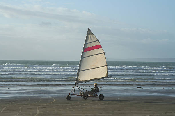 sailboat 2 France, Brittany, on the beach of Pentrez a sand yacht kite sailing stock pictures, royalty-free photos & images