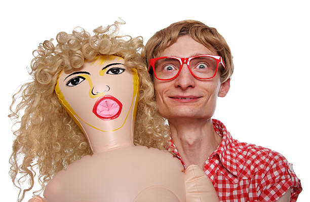 Guy with a blow up doll stock photo