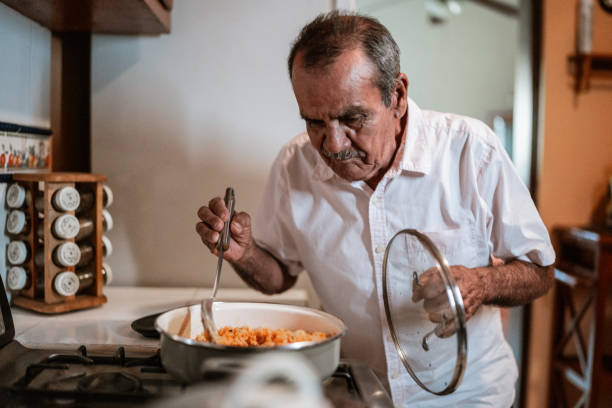 istock Senior man cooking in the kitchen at home 1792921832