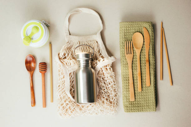 istock Different fabric bags for storage on a gray background. Eco bags for multiple use. A reusable straws, wooden cutlery 1792922346