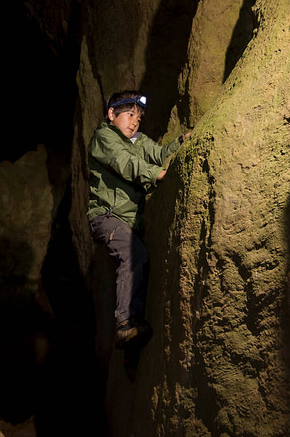 istock Boy caving in Thor's cavern, derbyshire 179292260