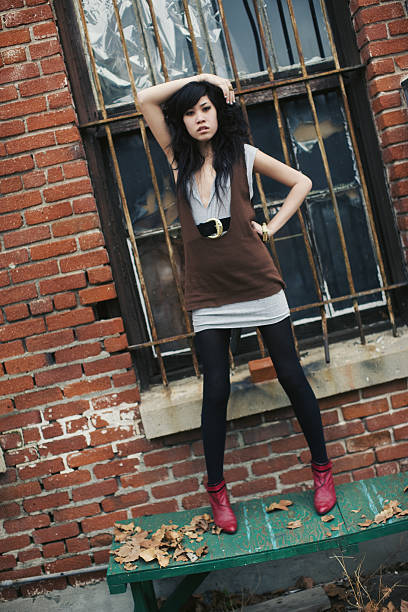Fashion model in stylish clothes in studio. Modern style