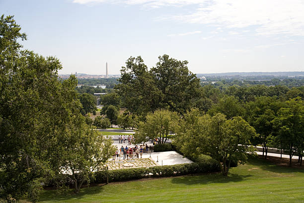 John F. Kennedy Grave and Washington Monument stock photo