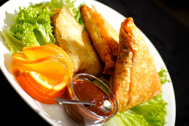 samosa with plum sauce stock photo