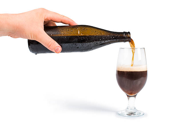 istock Hand holding bottle of beer and mug 179294075