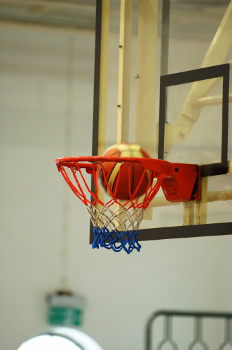 A motion of basketball swishing through the hoop