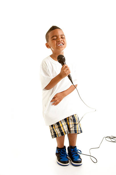 istock Little Boy Sings His Heart Out into a Microphone. 179294483