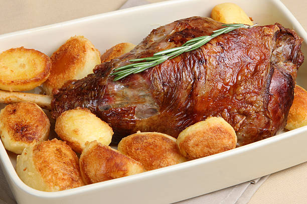 Roast Leg of Lamb with Potatoes stock photo