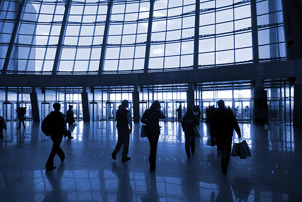 istock People silhouettes at airport building 179295002