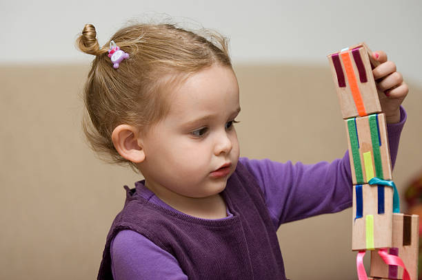 istock Girl play with a toy 179295198