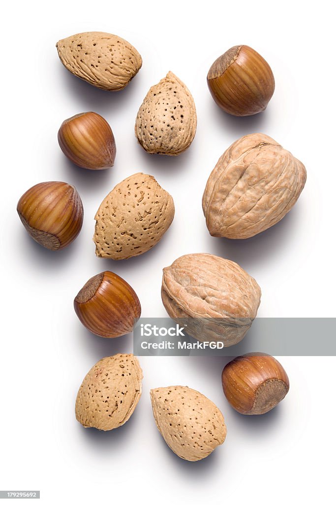 Almonds hazelnuts and walnuts Almonds hazelnuts and walnuts isolated on whiteFor more images of nuts Almond Stock Photo