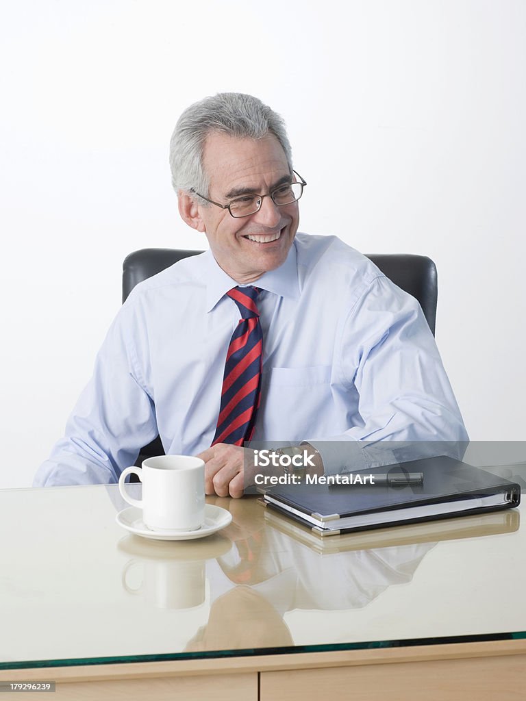 Successful Business Executive "Happy smiling executive, sitting at his desk." Adults Only Stock Photo