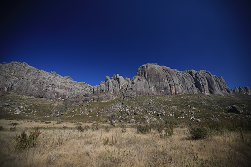 mountain range in central Madagascar, deep blue sky in background