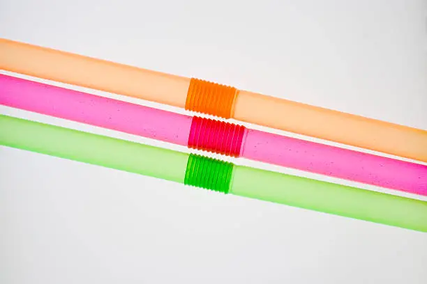 Three angled and colored drinking-straws