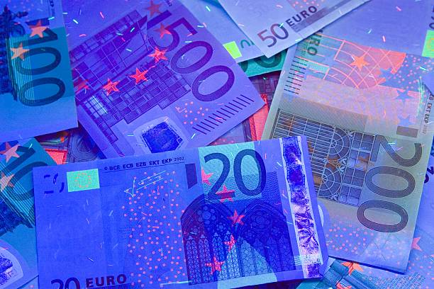 euro in uv light protection stock photo