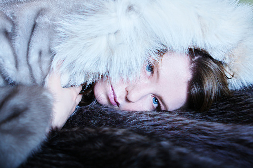 beautiful fashion woman close-up portrait in silver furs