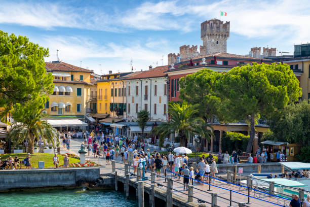 Holidays in Italy - the tourist resort of Sirmione on Lake Garda Holidays in Italy - the tourist resort of Sirmione on Lake Garda brescia stock pictures, royalty-free photos & images