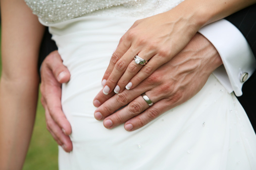 Close up of unrecognizable couple holding hands. Copy space.