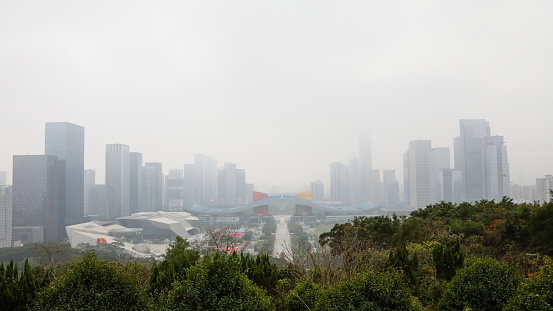 China Shenzhen city financial center downtown building skyscrapers fog