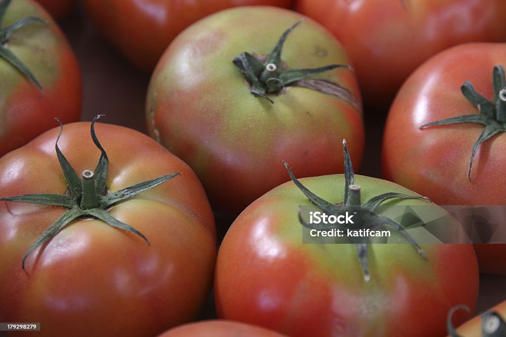 Organic Tomatos These tomatoes weren't quite ripe but they were ready for anyone that had a hunger! Beauty Stock Photo