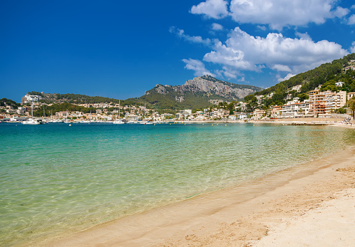 Sandy beach by the blue sea in Port de Soller, Mallorca