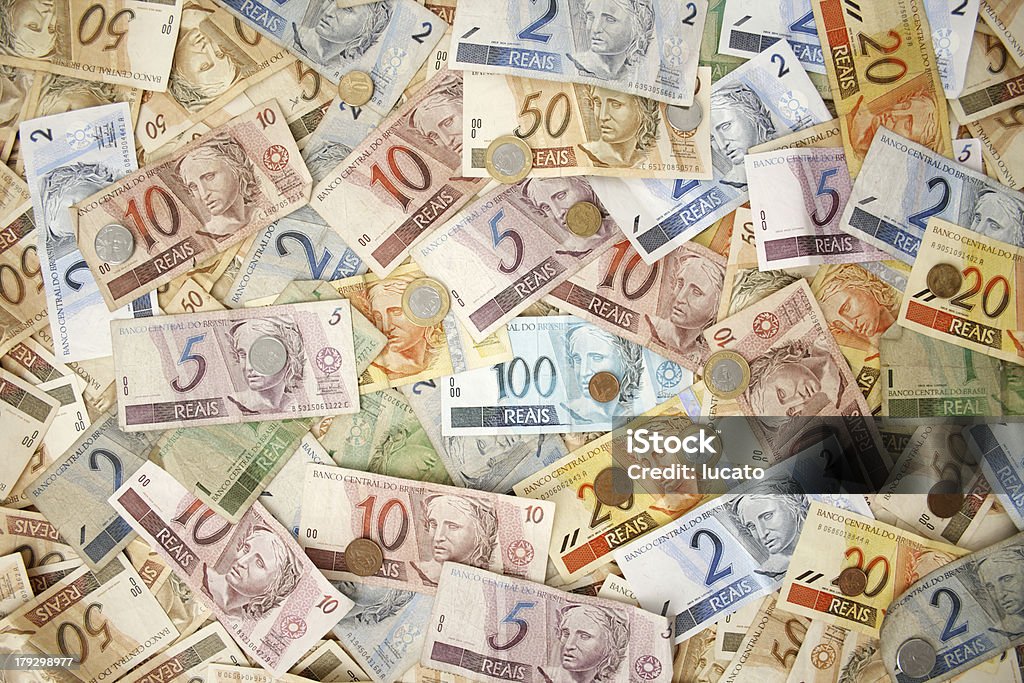 Brazilian money background "Reais (Real), Brazilian money background with coins and bills.See my money images serie by clicking on the link below:" Paper Currency Stock Photo