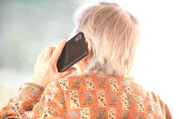 istock elderly woman talking on mobile phone 1792991984