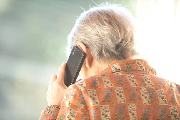 istock elderly woman talking on mobile phone 1792991986