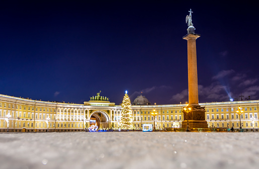 New Year's tree on the Palace Square and the arch of the General Staff building in St. Petersburg in the  winter night.