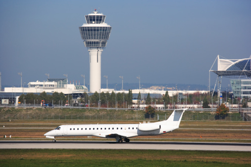 regional jet airplane on runway at Munich airport, Germany, waiting for takeoff, control tower in backgroundhttp://www.microstockgroup.com/lightbox/transport.jpg