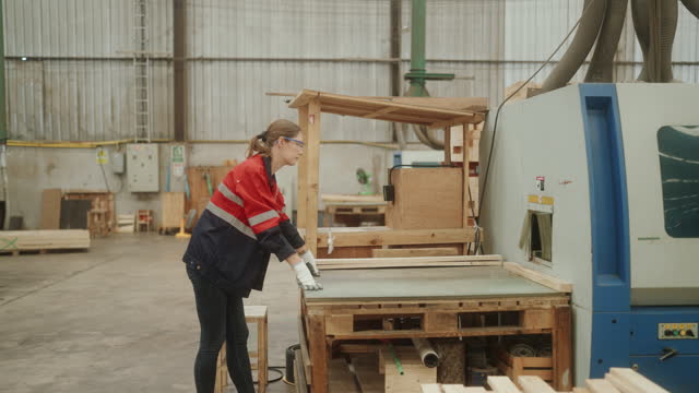 Female Workers Operate Edge Banding Machine in Industrial Workshop..