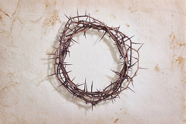 Crown of thorns on textured paper stock photo