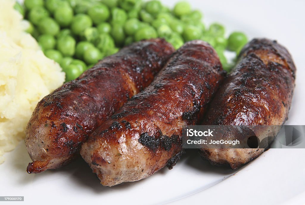 Sausages Pork sausages with mashed potato and peas Close-up Stock Photo