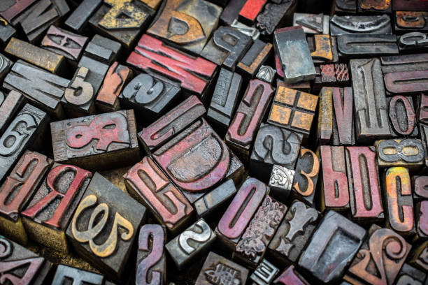 istock A textured background of old, used, wooden type-setting letter blocks with various fonts, upper- and lowercase, antique letters, all shapes and sizes. 1793002249