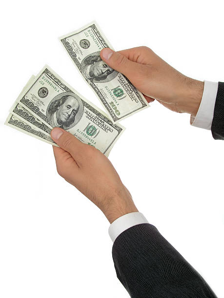 istock Businessman’s Hands Counting Money 179301040