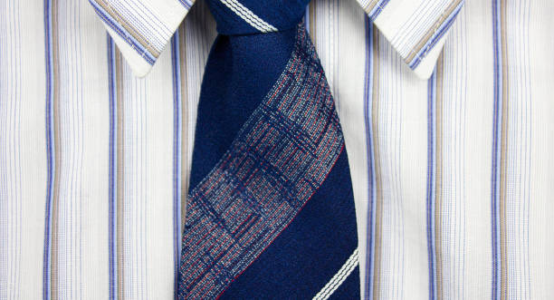 istock White classic men's striped shirt with blue tie. 1793013557