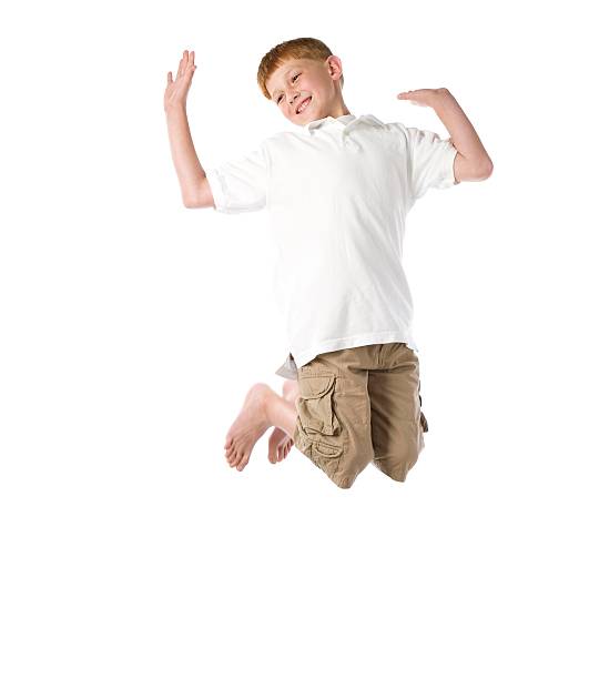 istock Red Haired Boy Jumps in Air 179301488