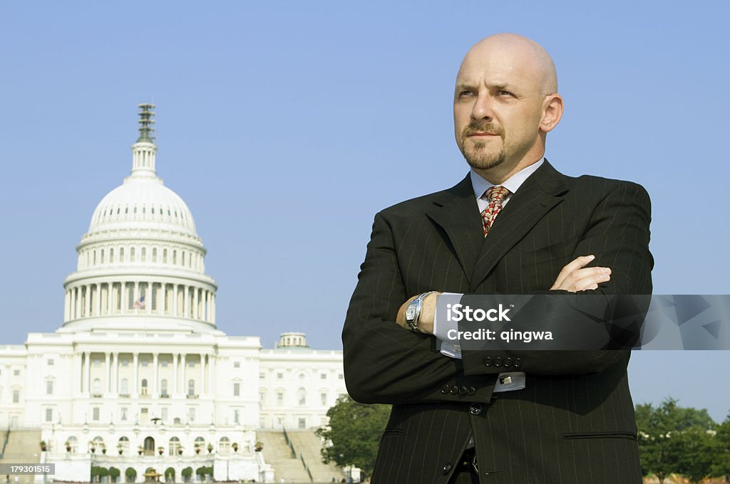 Serious Powerful Caucasian Businessman, Suit, Standing, US Capitol,  Washington DC Confident man next to US capitol building. - See lightbox for more Men Stock Photo