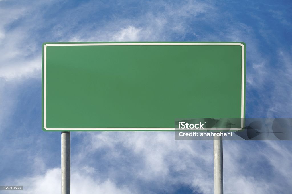 blank green traffic sign blank green traffic sign white cloudy sky on background Road Sign Stock Photo