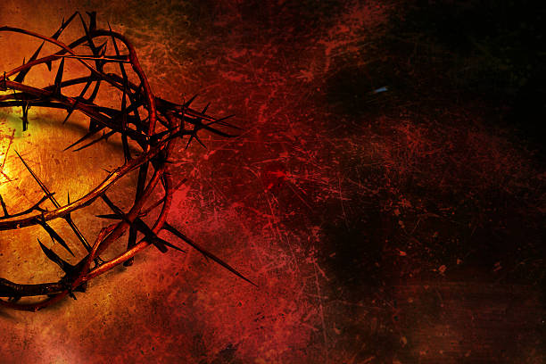 Crown of thorns on deep red grunge background stock photo