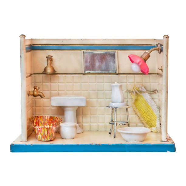 Old weathered doll house bathroom isolated on a white background